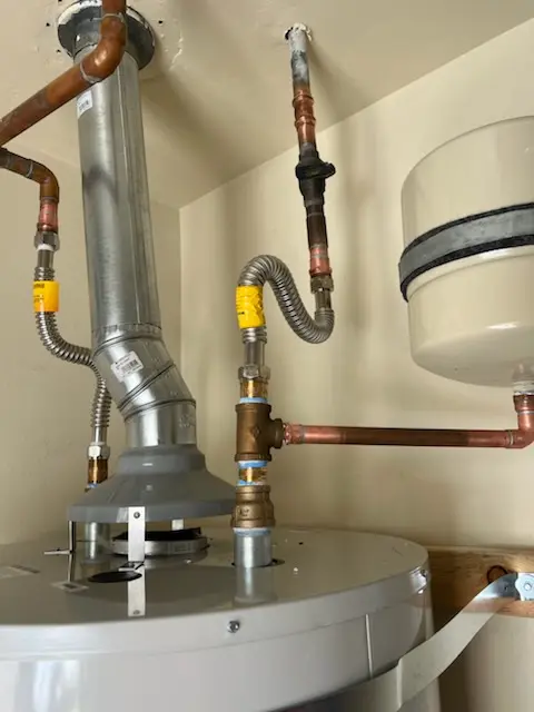 Water heater installation and plumbing repair in Mystic